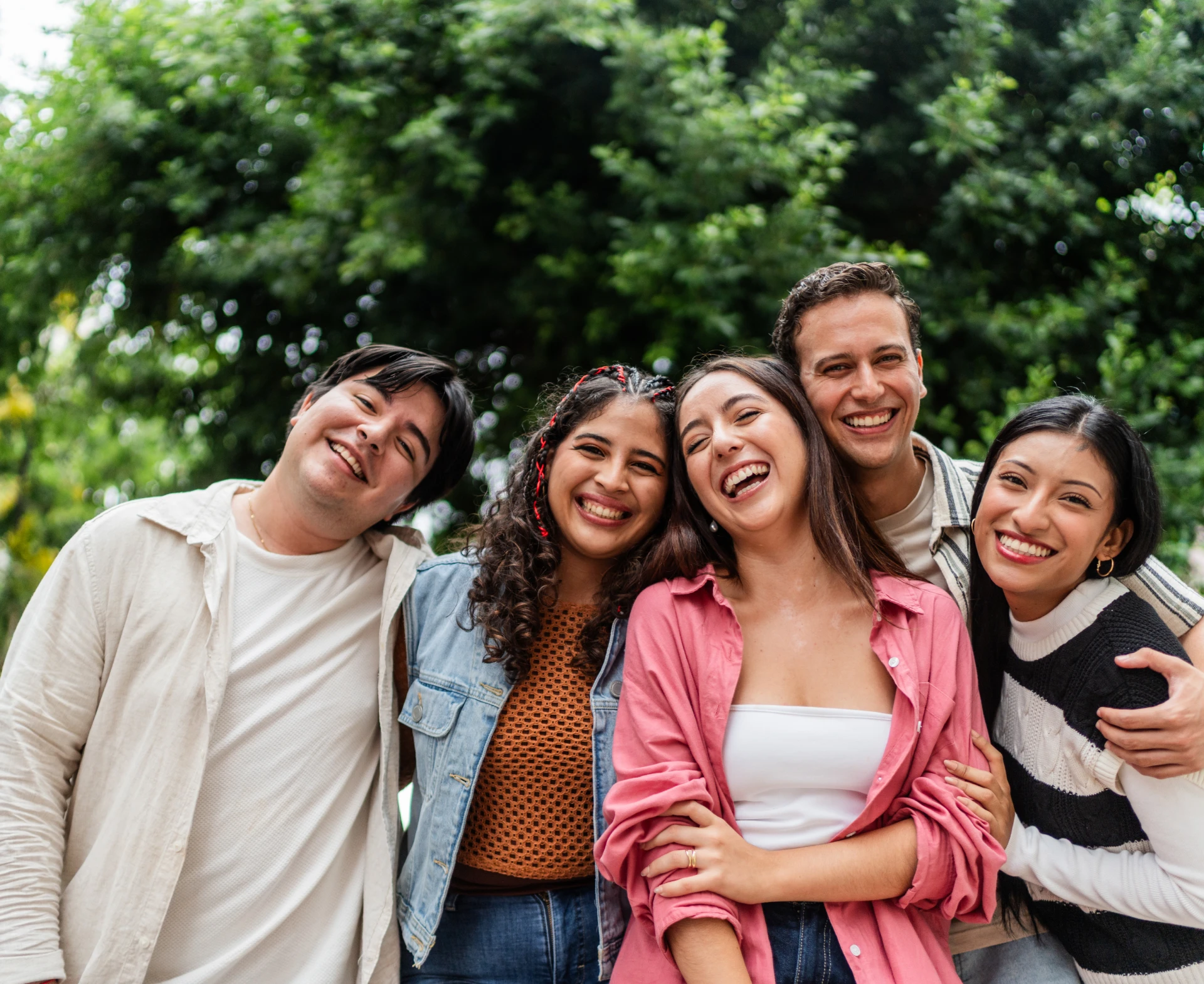 Cheerful group posing in nature